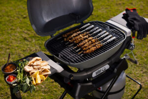 Meat on the bone being cooked on a BBQ
